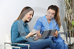 Nurse explaining medical procedure to a patient photo