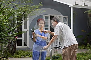 Nurse explaining procedure to patient . Nursing home service and elderly people health care. Elderly care concept