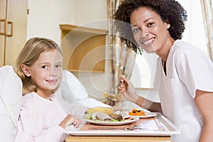 Nurse Feeding Young Girl