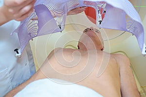 Nurse fitting structure over patient`s body