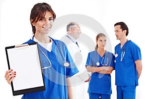 Nurse with folder team of doctors