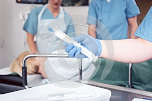 Nurse giving anesthesia to patient waiting for endoscopy