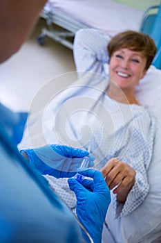 Nurse giving an injection to a patient