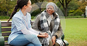 Nurse, happy and relax with old woman on park bench for retirement, elderly care and conversation. Trust, medical and