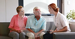 Nurse have discussion with her senior patients