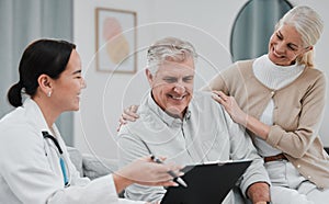 Nurse, healthcare and planning with a senior couple in their home, talking to a medicine professional. Medical