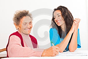 Nurse Helping Elderly Register for Nursing Home