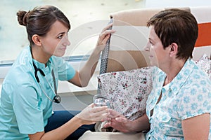 Nurse helping her patient