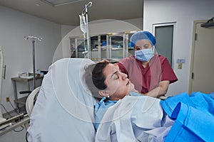 Nurse helping patient in surgery