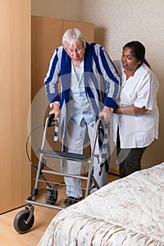 Nurse helping with rollator