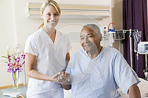 Nurse Helping Senior Man To Walk