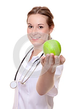 Nurse holding green apple