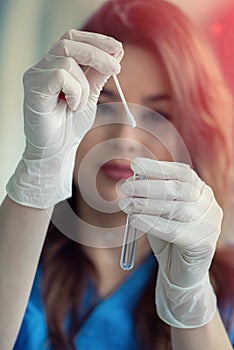 Nurse holding nasal swab laboratory test for Coronavirus or COVID-19