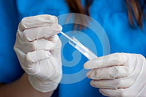 Nurse holding nasal swab laboratory test for Coronavirus or COVID-19