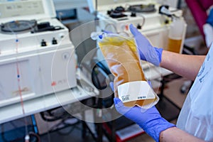 Nurse holding a plasma bag