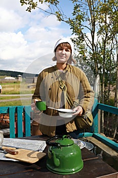 Nurse holding plate and cup