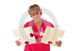 Nurse Holding Puzzle Pieces photo