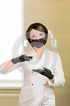 Nurse holding test tubes photo