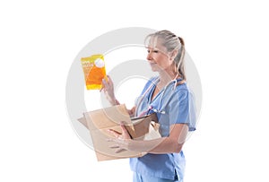 A nurse holds a box of N95 respirator masks