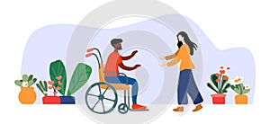 The nurse holds out her hands to a man in a wheelchair. Inclusion in public life