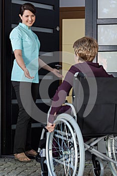 Nurse invites a disabled woman to the house photo
