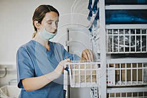 Nurse looking for medical supplies photo