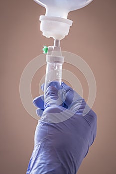 Nurse managing fluid with a dropper