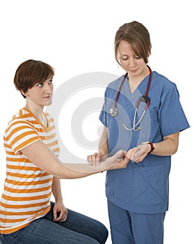 Nurse measuring patient's pulse