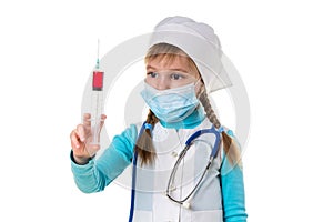 Nurse with medical face mask, looking at the syringe with a red liquid, on white landscape background