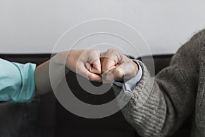 nurse older man fist bumping. High quality photo