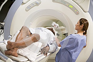 Nurse With Patient As They Have CAT Scan