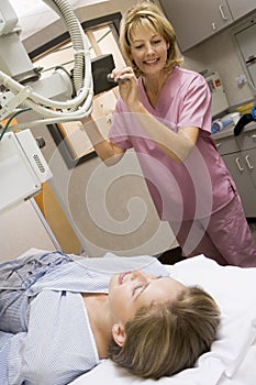 Nurse With Patient Having An X-Ray