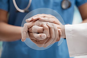 Nurse with patient holding hands for help, support and healthcare advice after cancer results, medical check or sad news