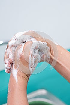 Nurse perform surgical hand washing, Preparation to the operating room. Closed-up of the hands.