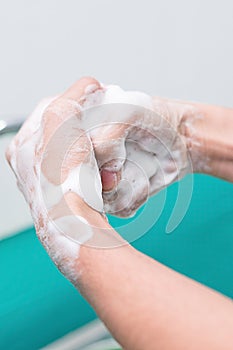 Nurse perform surgical hand washing, Preparation to the operating room. Closed-up of the hands.