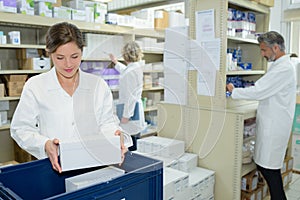 Nurse and pharmacists working in pharmacy