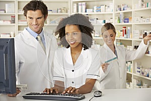 Nurse and pharmacists working in pharmacy