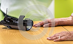 Nurse and physiotherapists helping elderly person to regain her body mobility