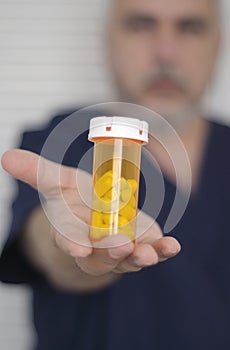 Nurse with pill bottle