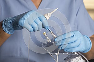 Nurse Prepares Dextrose Infusion