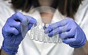 Nurse prepares medication in ampoules for oxygen mask in a hospital