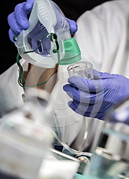 Nurse prepares oxygen mask in hospital