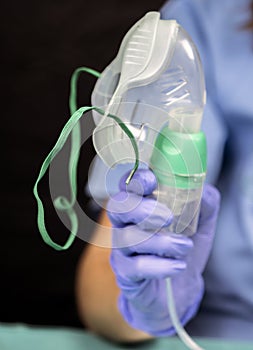 Nurse prepares oxygen mask in hospital