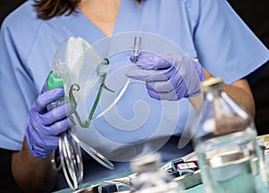 Nurse prepares oxygen mask in hospital