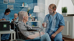 Nurse preparing effervescent pill in water glass for patient