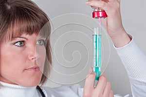 Nurse preparing injektion isolated on white photo