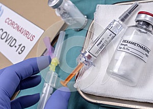 Nurse preparing medical treatment with Dexamethasone and heparin in the hospital photo