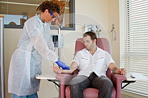 Nurse preparing patient for chemotherapy