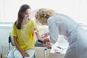 Nurse preparing to make an injection for blood taking. Medical test