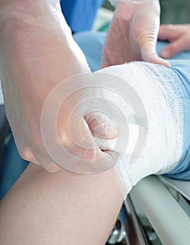 Nurse provides first aid bandage